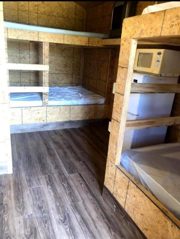 Room With Two Bunk Beds and wooden floor